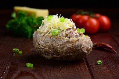 jacket-potato-tuna-cheese-garnished-260nw-222154459